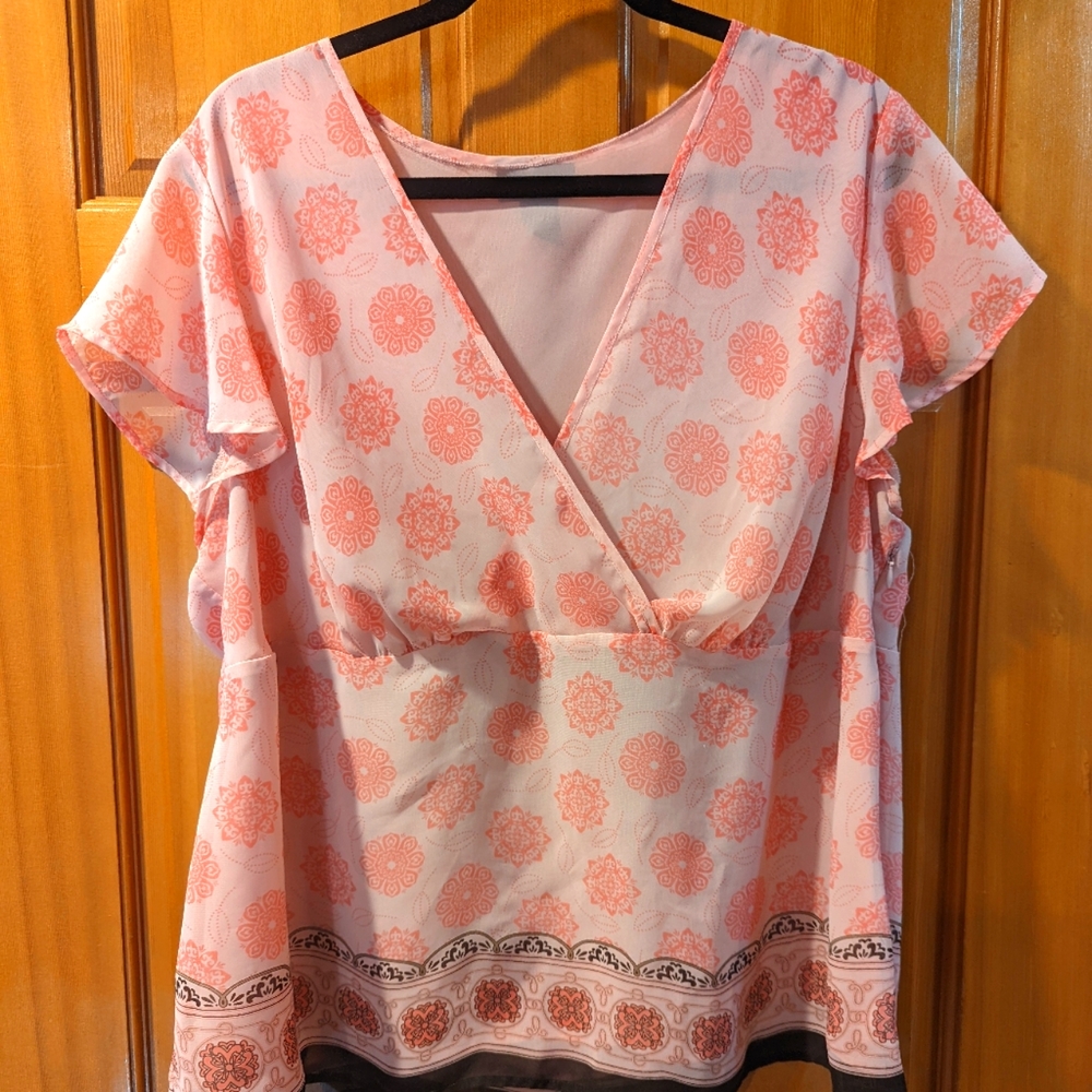 A lovely sheer blouse, fully lined with flutter sleeves and side zip.